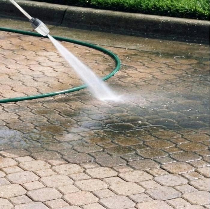 Jetterix blasting dirt off paver stones in seconds